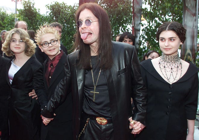 Ozzy Osbourne arrives at the 42nd Grammy Awards with his family in Los Angeles on Feb. 23, 2000. Osbourne's group Black Sabbath won a Grammy for best metal performance for the song "Iron Man" on the album "Reunion."